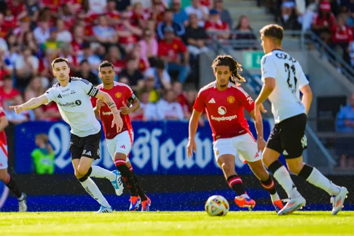 YORO IN MAN UNITED SHIRT