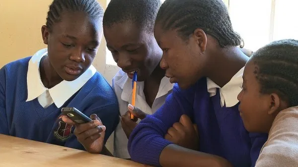 STUDENTS USING PHONE